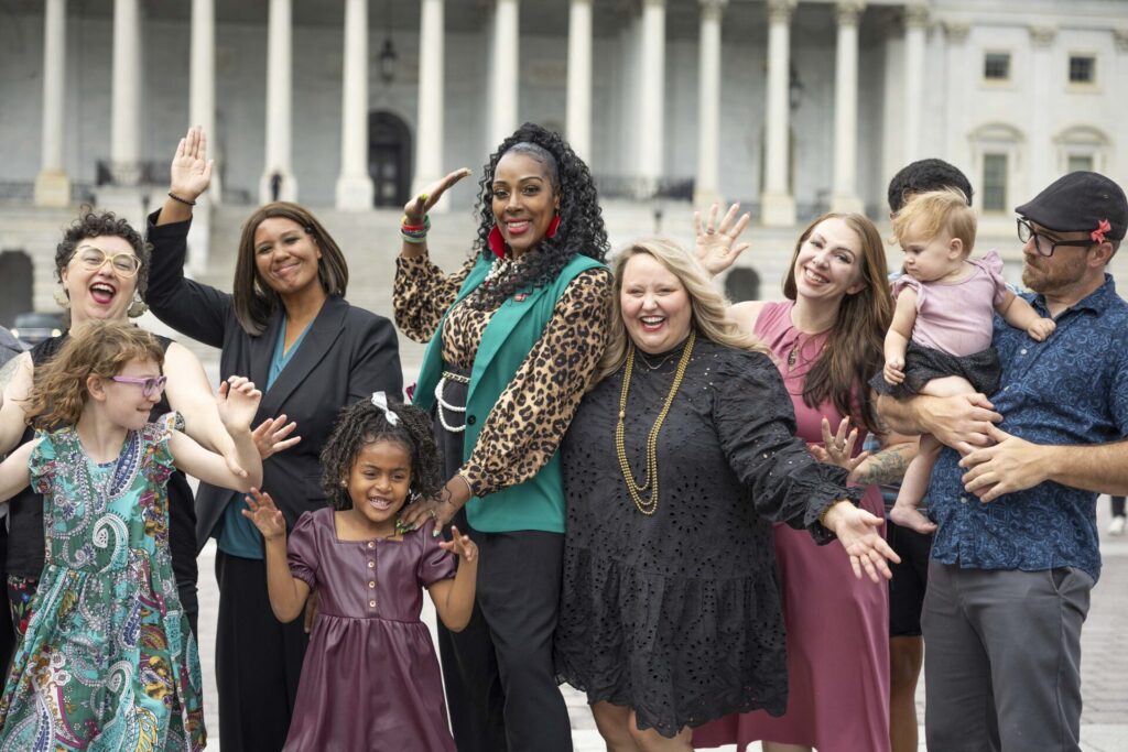 Advocates gather in front of the Capitol dome