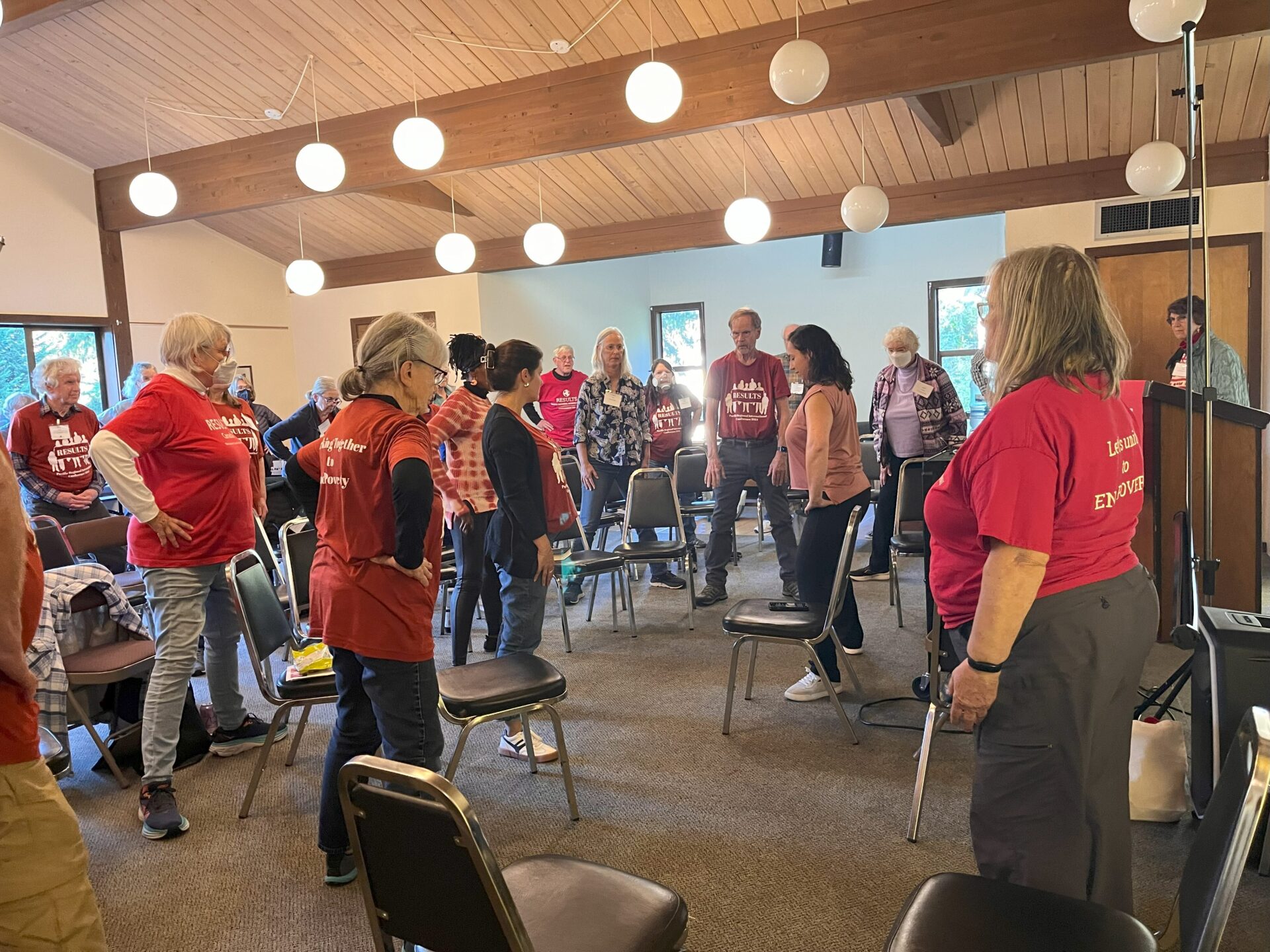 Group of RESULTS advocates stretching in between meetings at the PNW Conference 2024