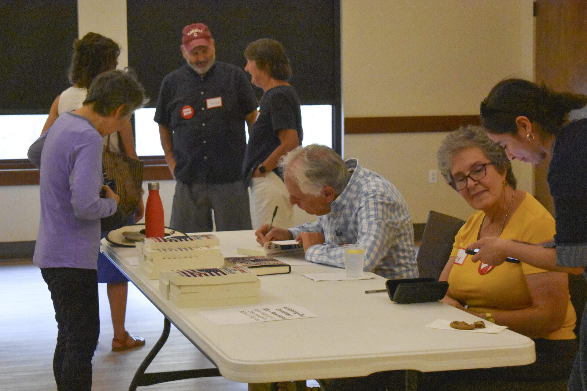 Sam Daley-Harris signs copies of his book Reclaiming Democracy
