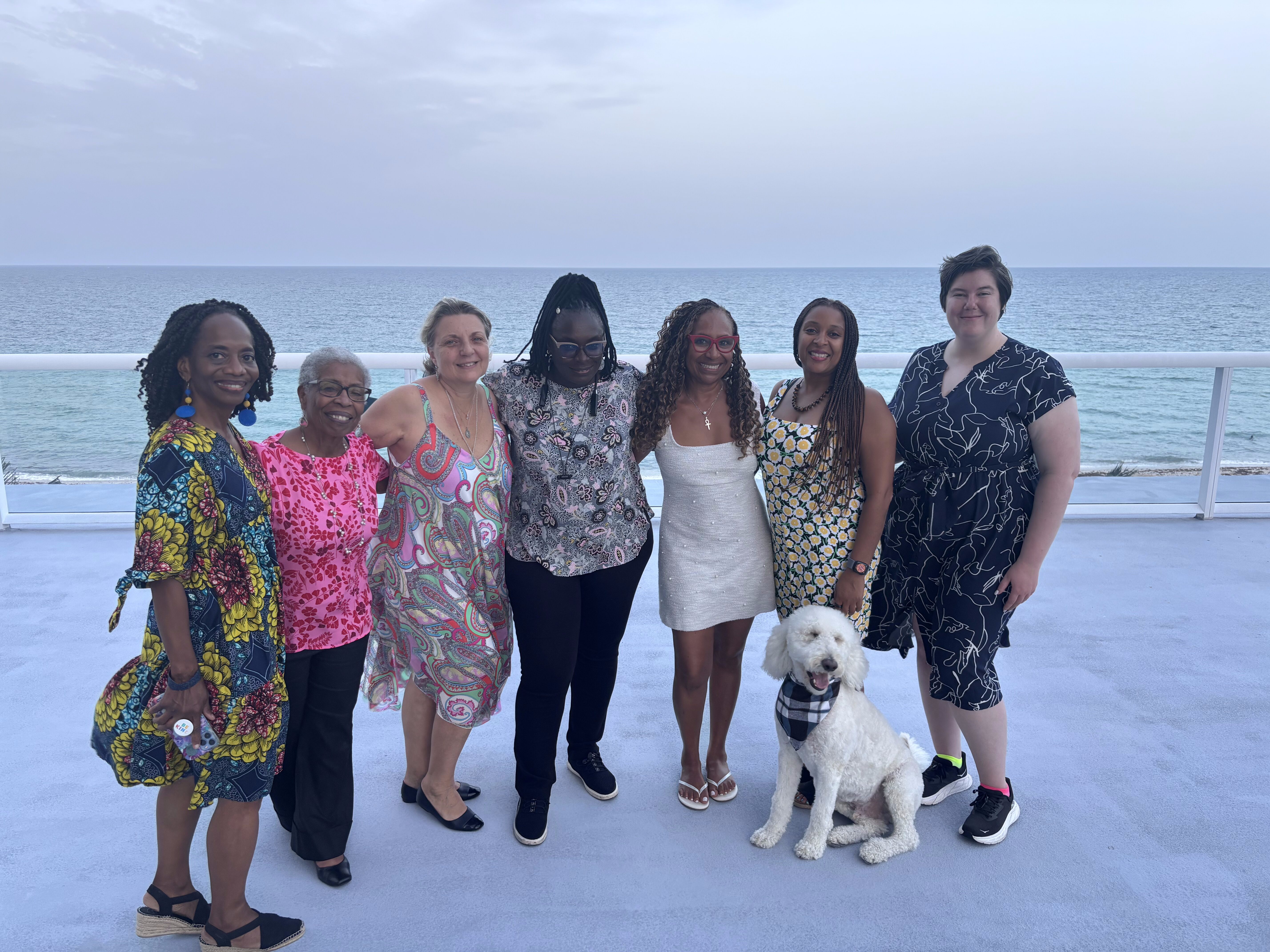 A group of RESULTS folks pose with Maurine Murenga.
