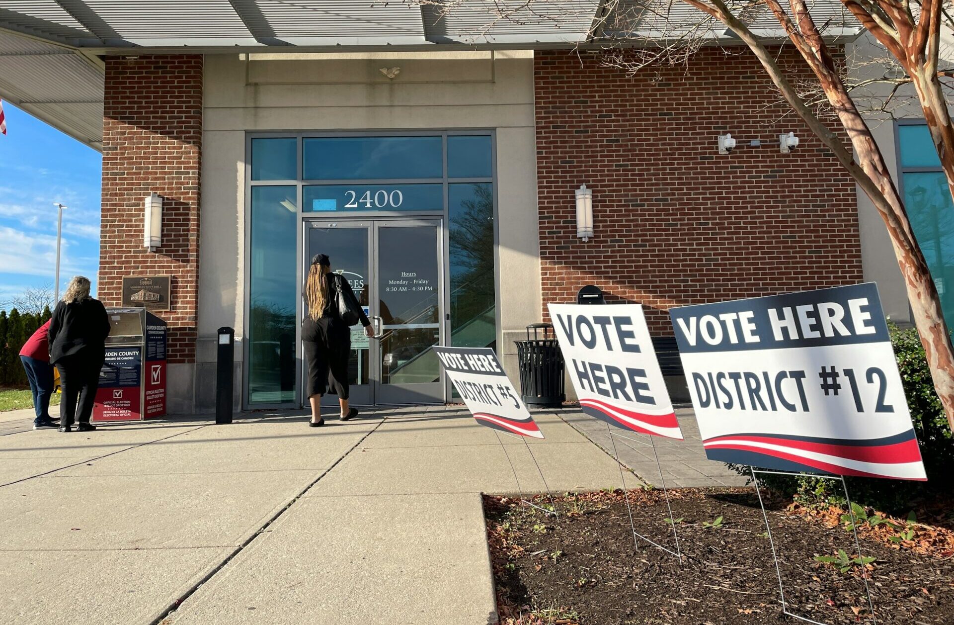 Building with signs outside saying to vote here