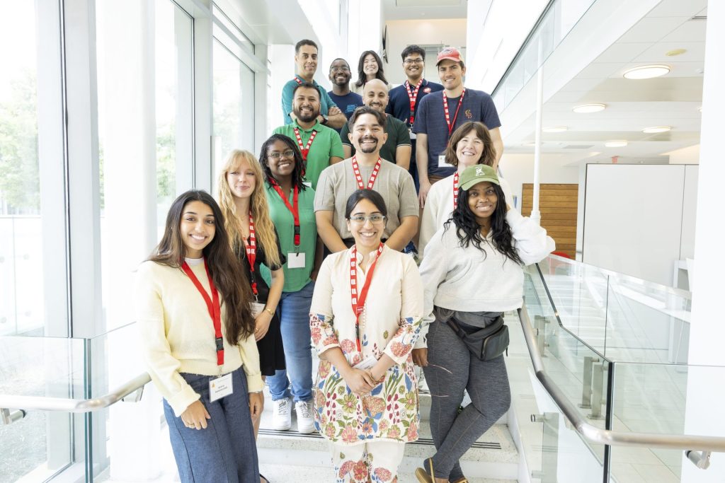 Fellows gather on a staircase