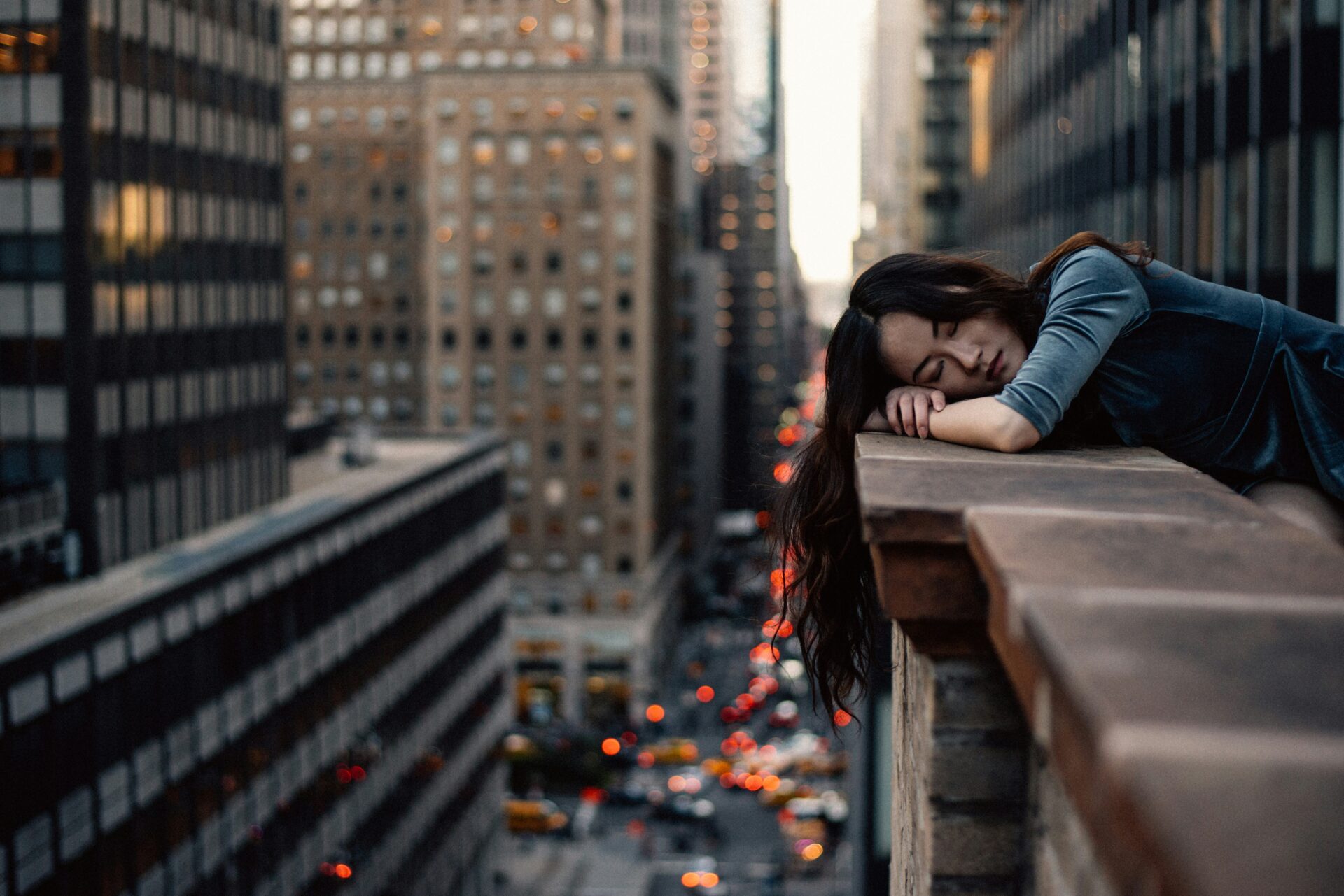 Woman lying on ledge